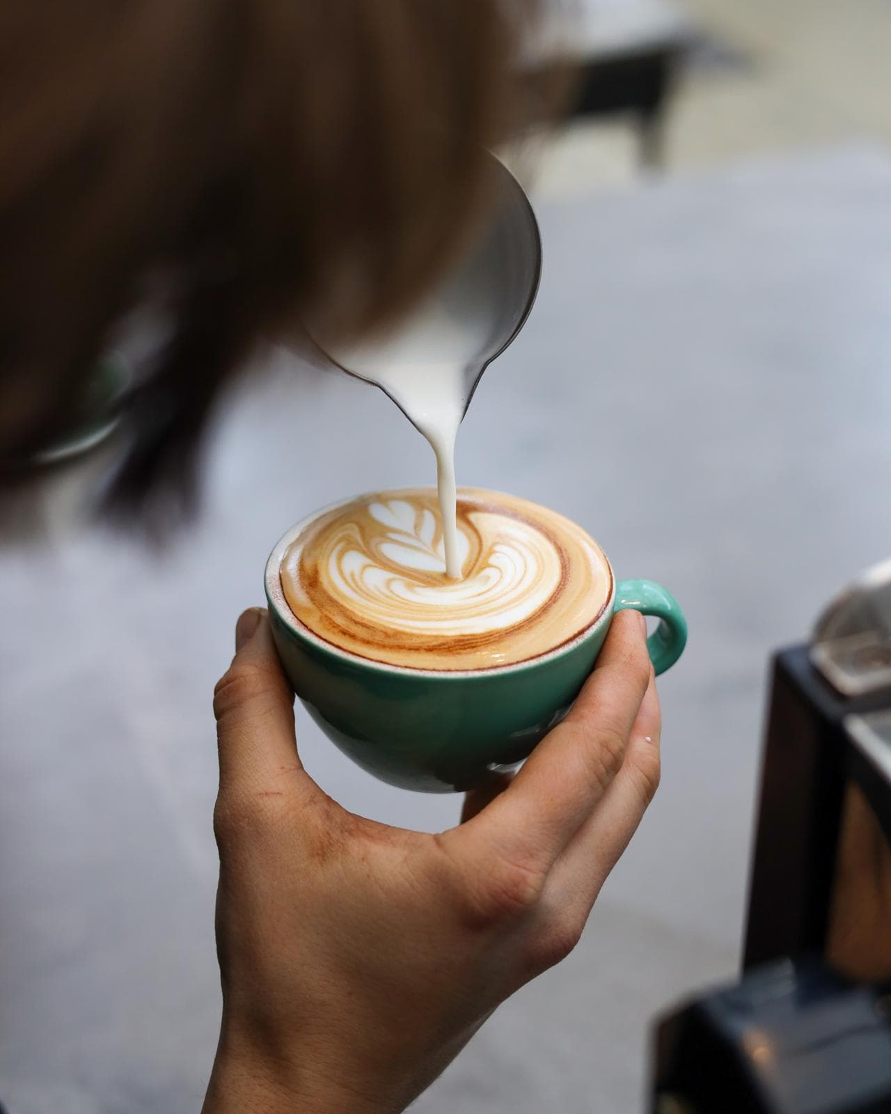 Latte art being poured from above