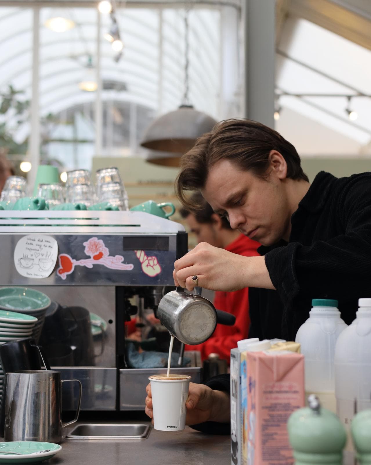 Niall Burns pouring latte art